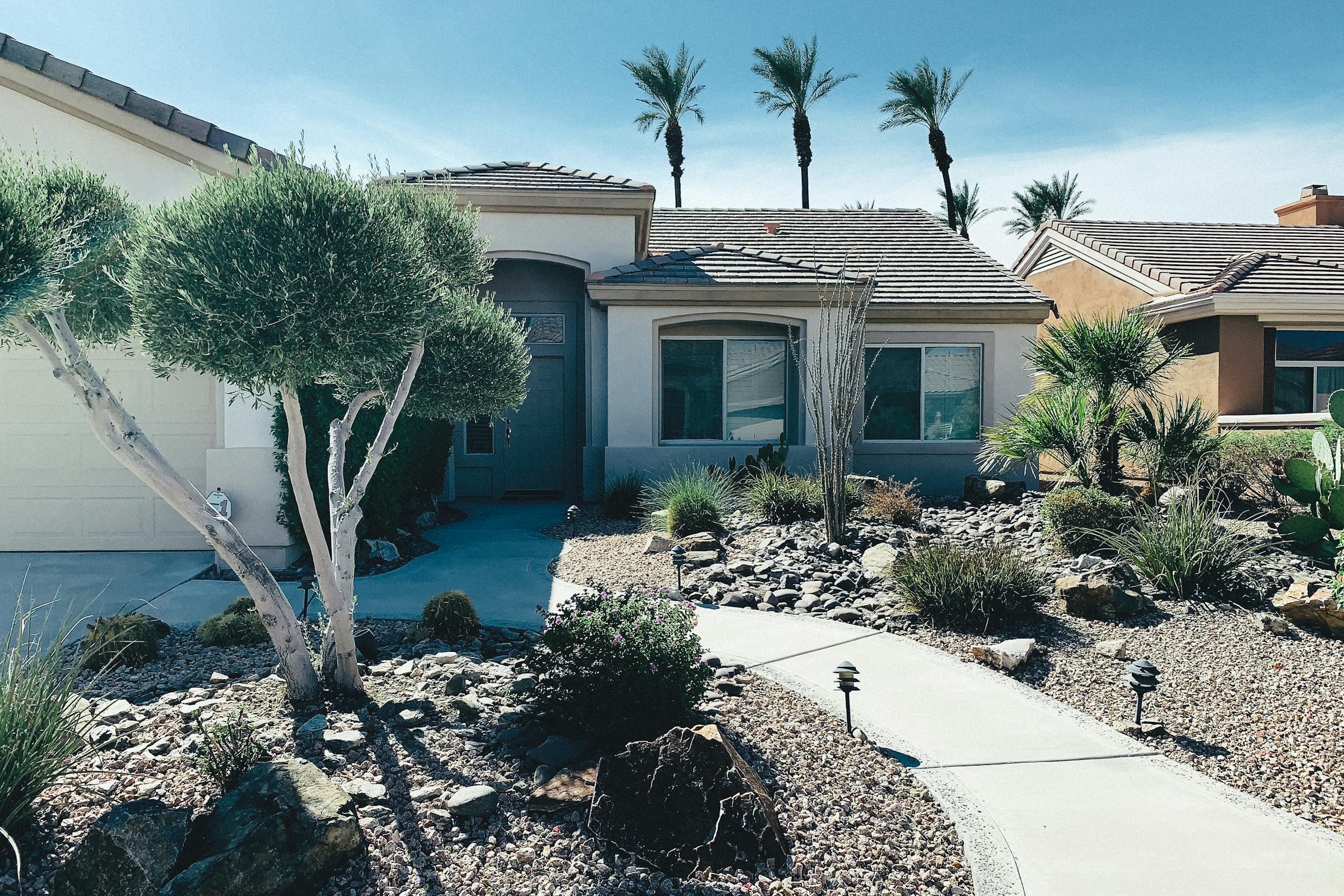 Xeriscape home with palms and gravel front, Tucson area